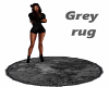 Grey round fur rug