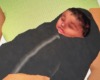 Junior in black swaddle