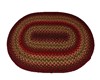 RED BRAIDED OVAL RUG