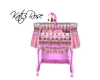 Pink bassinet with baby