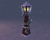 snow covered lamp post