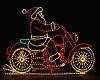 Neon Santa on a bike