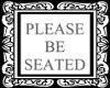 >A< Be Seated Sign