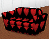 Red Heart on Black Sofa