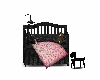 black and pink crib