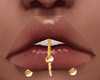 Gold lips piercing