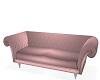 Pink couch with stones