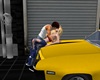 Couple Kissing On A Car