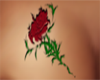 Red rose breast tattoo