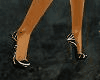 [A] black glittery pump