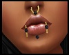 Gold/Black face piercing