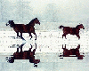 Horses running in winter