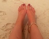 Lovely feet in the sand