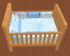 Light wood boy's crib