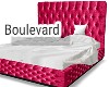 Pink tufted bed