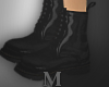 Black martens boots.