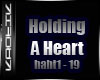 {k} Holding a heart