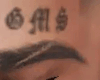 GM$ Forehead Tattoo
