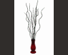 lighted branches in vase