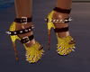 A $ $ Gold spike heels