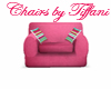 pink chair with pillows