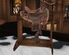 dark wood saddle chair